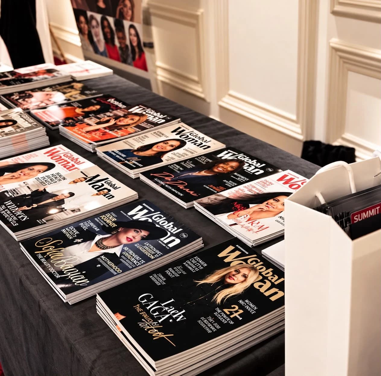 Global Woman Magazine copies on display at a launch event