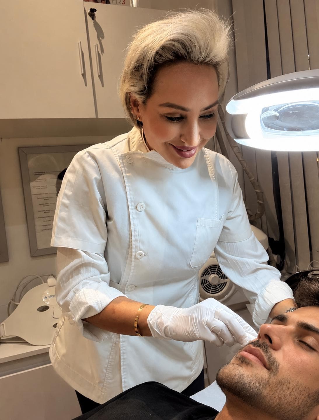 Dr Sofia carefully assessing a patient's face before anti-wrinkle treatment